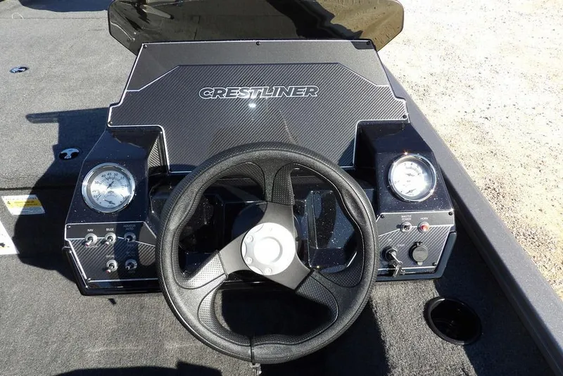 Slide: The Image of 2026 Crestliner XF 189 boat dashboard with steering wheel and gauges. - 25