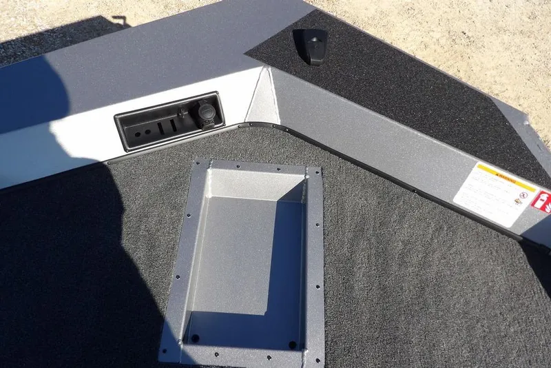 Slide: The Image of 2026 Crestliner XF 189 boat interior with storage compartment and control panel. - 30