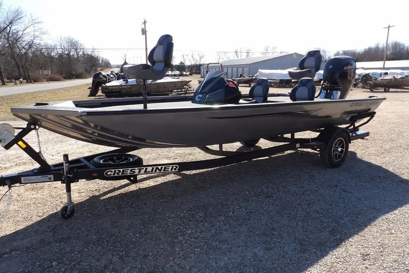 Slide: The Image of 2026 Crestliner XF 189 fishing boat on trailer, parked outdoors. - 4