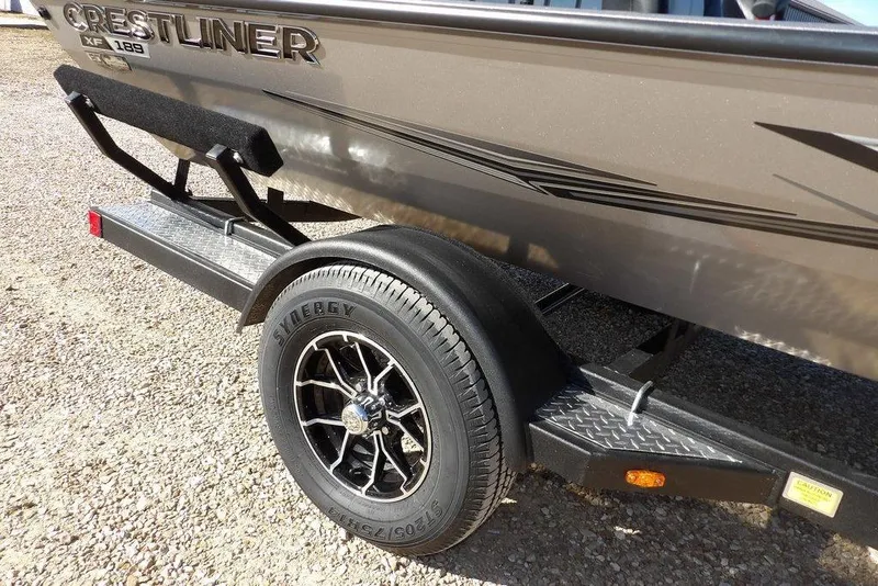 Slide: The Image of 2026 Crestliner XF 189 boat on trailer with stylish black wheel. - 41