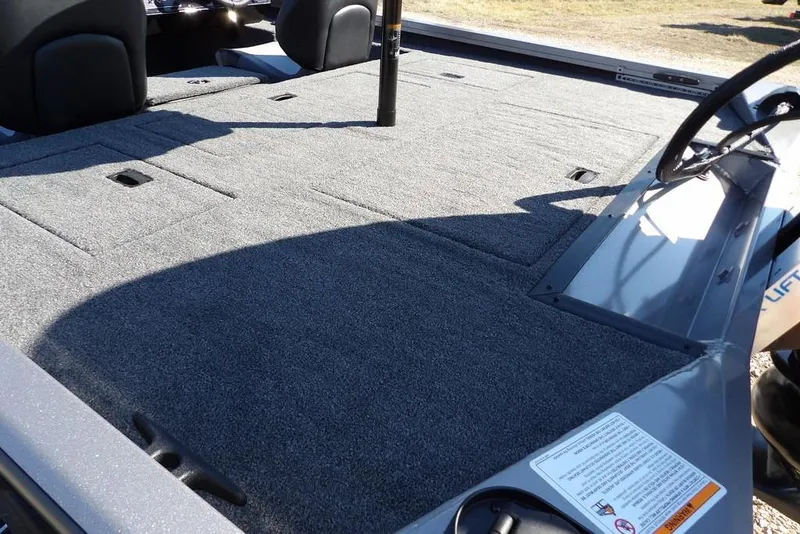 Slide: The Image of 2026 Crestliner XF 189 boat interior with spacious carpeted deck and seating. - 6