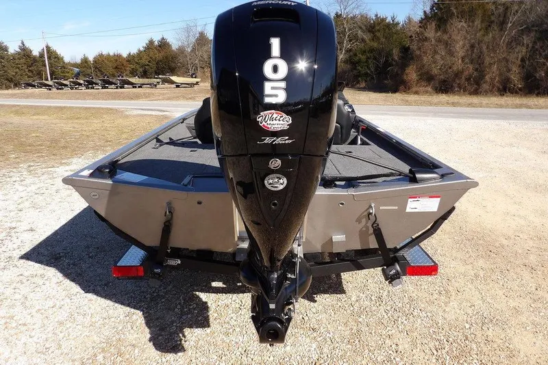 Slide: The Image of 2026 Crestliner XF 189 boat with powerful 105 HP outboard motor, parked outdoors. - 9