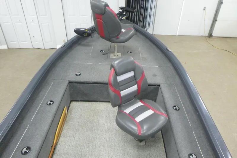 Slide: The Image of 2021 Ranger VS1660 T boat interior with two gray and red seats. - 5