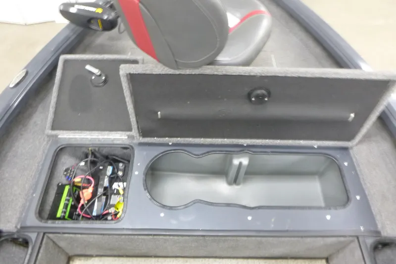 Slide: The Image of 2021 Ranger VS1660 T boat interior with open storage compartments and seat. - 6