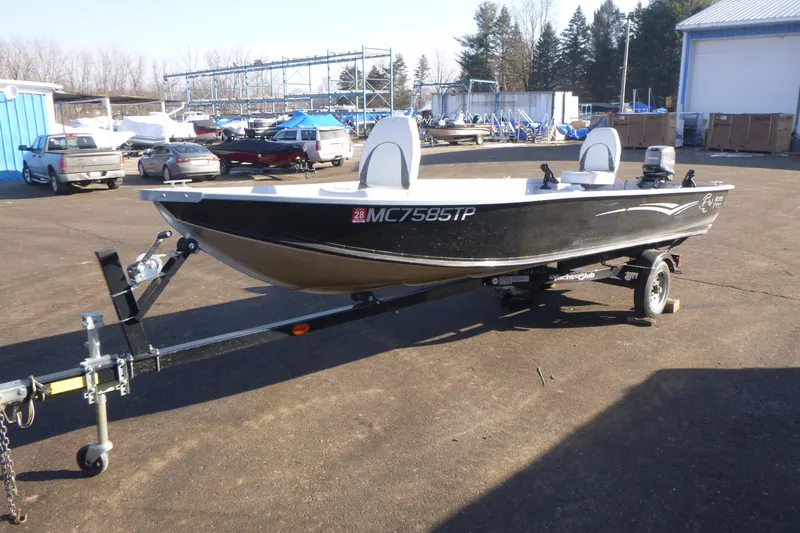 Slide: The Image of 2010 G3 Guide V16 XT boat on trailer in outdoor storage area. - 4