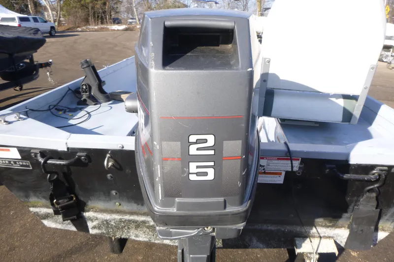 Slide: The Image of 2010 G3 Guide V16 XT boat with 25 HP outboard motor in parking lot. - 7