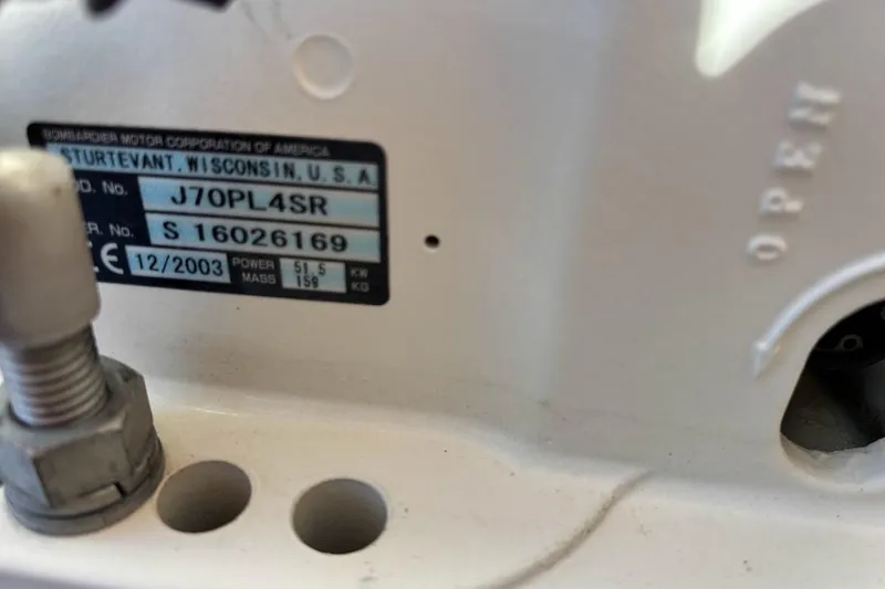 Slide: The Image of Label on machinery showing model J70PL4SR, serial S16026169, manufactured 12/2003. - 10