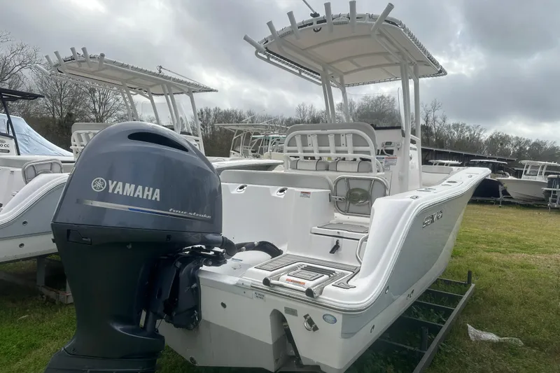 Slide: The Image of 2023 Sea Fox 228 Commander boat with Yamaha outboard motor, displayed outdoors. - 11