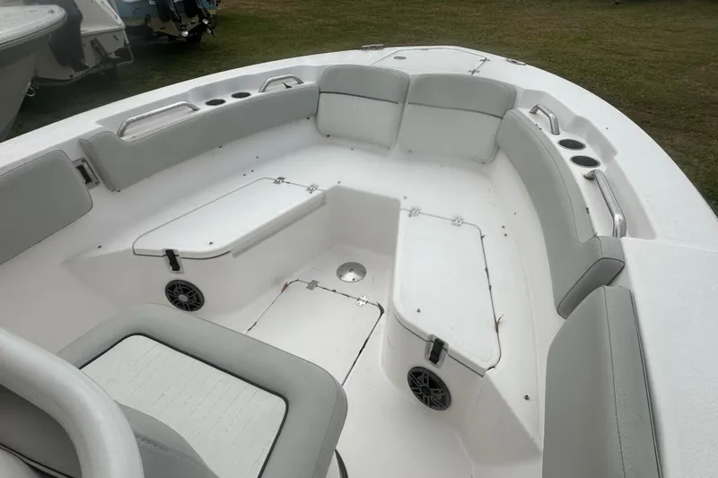 Slide: The Image of 2023 Sea Fox 228 Commander boat interior with cushioned seating and cup holders. - 16