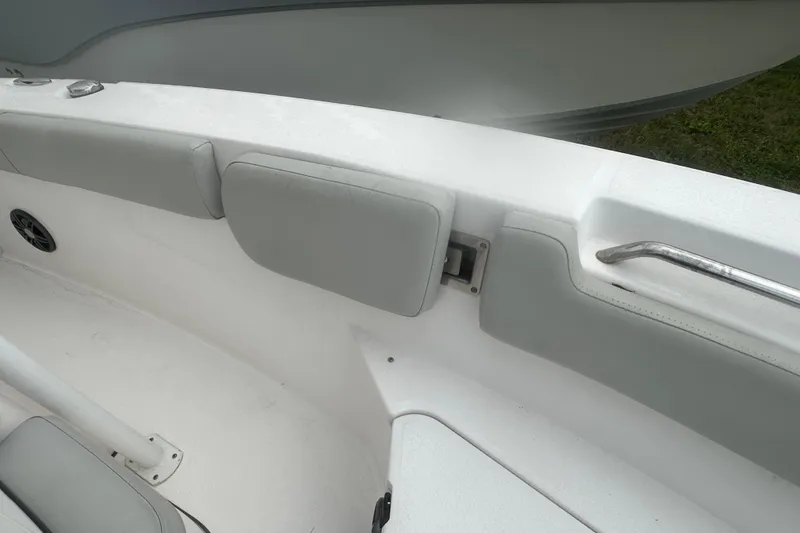 Slide: The Image of 2023 Sea Fox 228 Commander boat interior with cushioned seating and stainless steel handrail. - 18