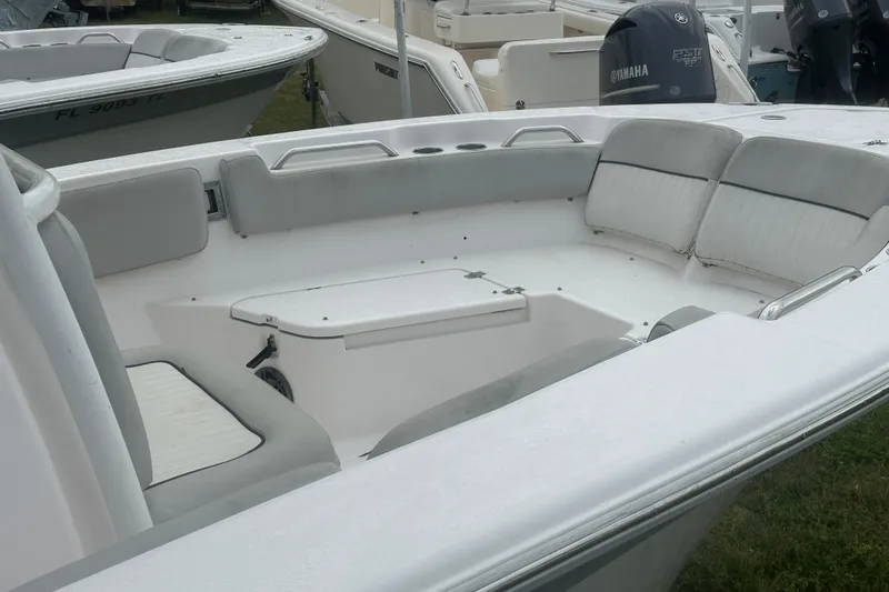 Slide: The Image of 2023 Sea Fox 228 Commander boat interior with cushioned seating and storage. - 23