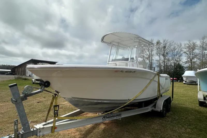 Slide: The Image of 2023 Sea Fox 228 Commander boat on trailer under cloudy sky. - 27