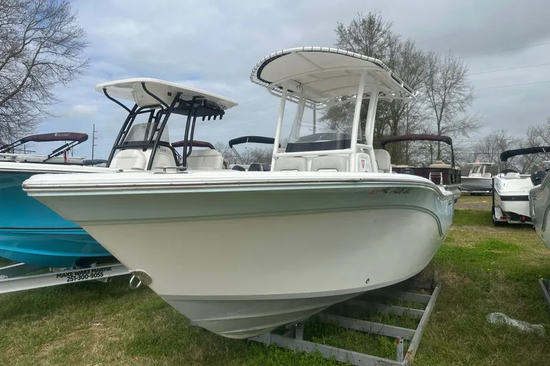 Slide: The Image of 2023 Sea Fox 228 Commander boat on display outdoors, showcasing sleek design and modern features. - 3