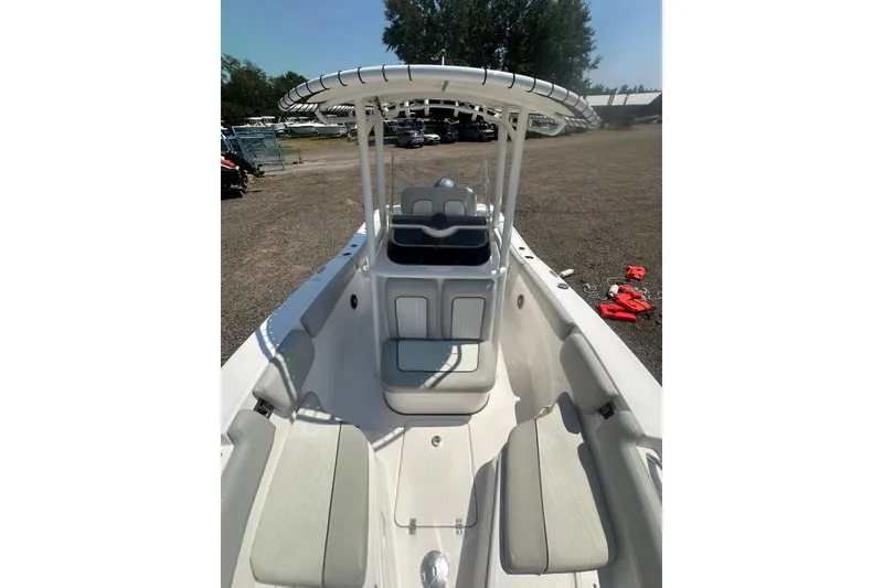 Slide: The Image of 2023 Sea Fox 228 Commander boat interior with seating and T-top canopy. - 33