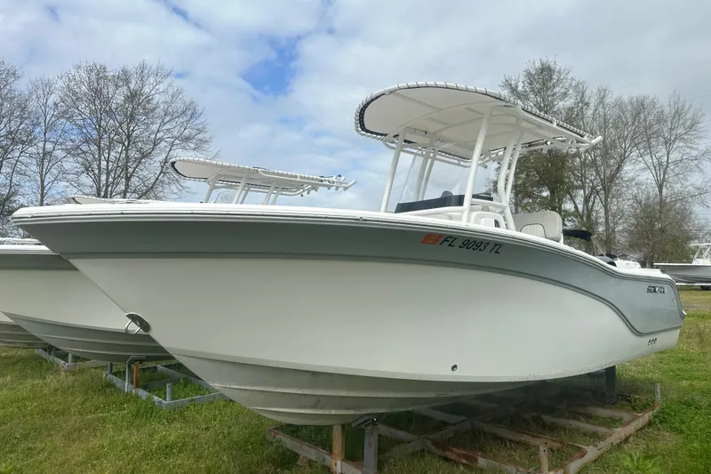 Slide: The Image of 2023 Sea Fox 228 Commander boat on display, featuring sleek design and white hull. - 7
