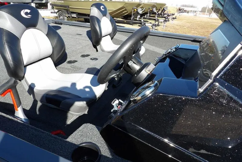 Slide: The Image of 2026 Crestliner XFC 189 boat interior with steering wheel and seats. - 10