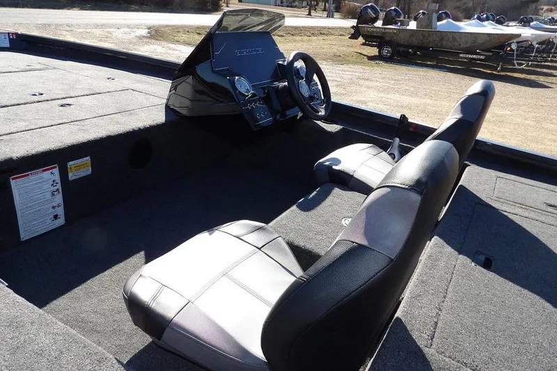 Slide: The Image of 2026 Crestliner XFC 189 boat interior with steering console and seating. - 11