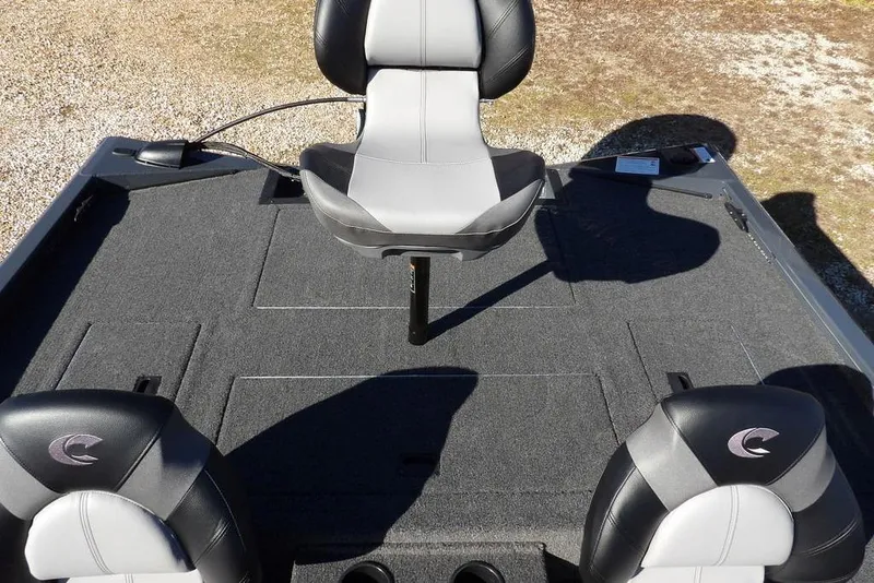 Slide: The Image of 2026 Crestliner XFC 189 boat interior with three cushioned seats on a carpeted deck. - 18