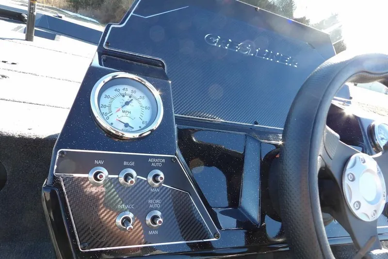Slide: The Image of 2026 Crestliner XFC 189 dashboard with speedometer and control switches. - 22