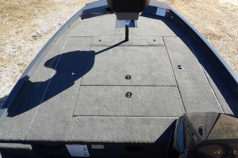 Slide: The Image of 2026 Crestliner XFC 189 boat deck with carpeted surface and storage compartments. - 24