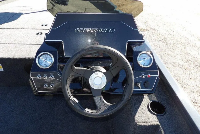 Slide: The Image of 2026 Crestliner XFC 189 boat dashboard with steering wheel and gauges. - 25