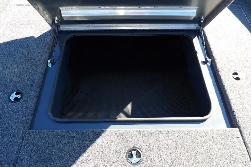 Slide: The Image of Open storage compartment on 2026 Crestliner XFC 189 boat deck. - 27