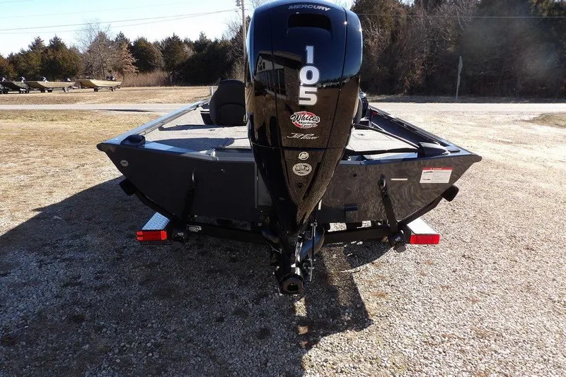 Slide: The Image of 2026 Crestliner XFC 189 boat with Mercury 105 engine, parked on gravel. - 3
