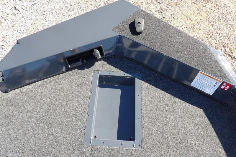 Slide: The Image of 2026 Crestliner XFC 189 boat deck with storage compartment and control panel. - 32