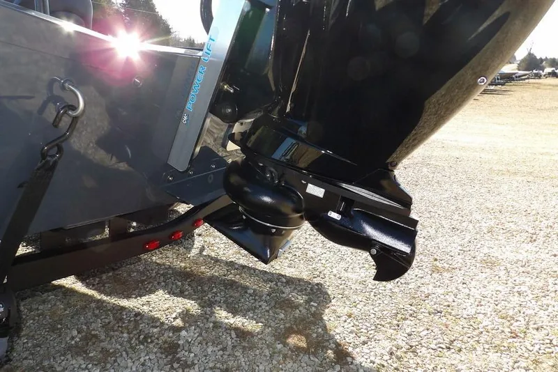 Slide: The Image of 2026 Crestliner XFC 189 boat motor and power lift detail in sunlight. - 36
