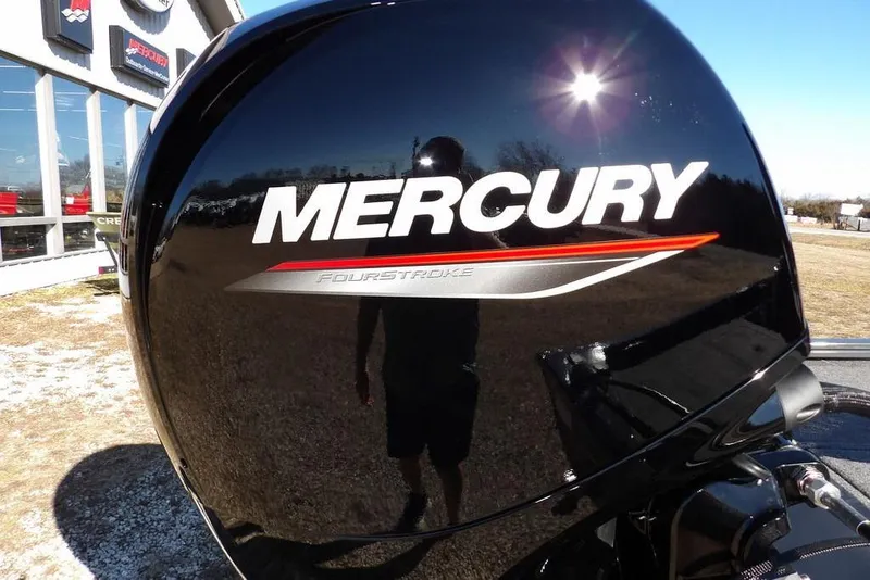Slide: The Image of Mercury FourStroke engine on 2026 Crestliner XFC 189 boat, outdoor dealership display. - 38