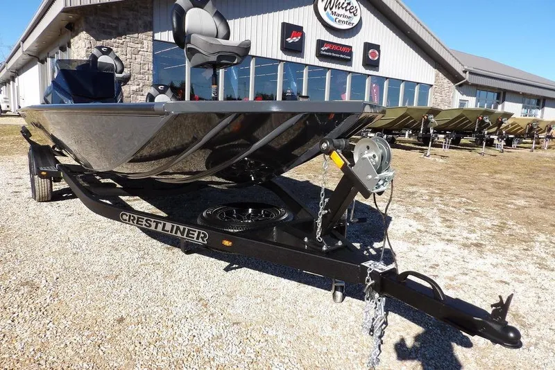 Slide: The Image of 2026 Crestliner XFC 189 boat on trailer outside marine center. - 39