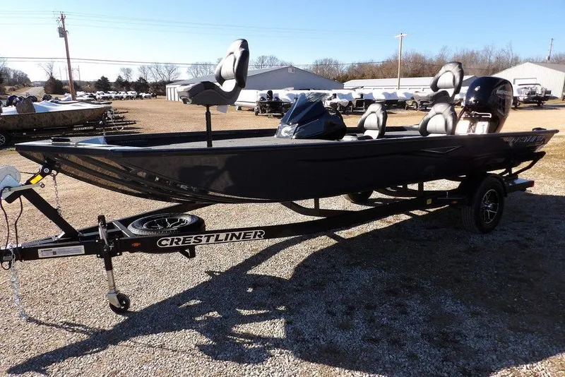 Slide: The Image of 2026 Crestliner XFC 189 fishing boat on trailer in outdoor setting. - 5