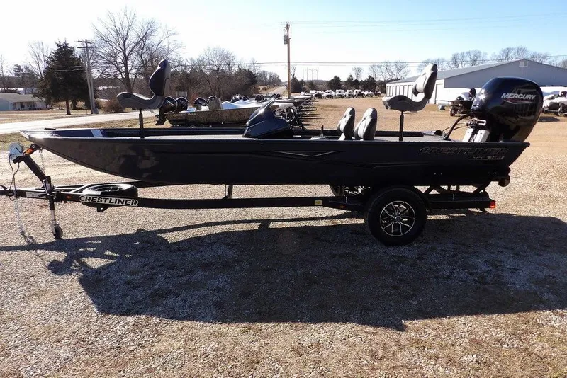 Slide: The Image of 2026 Crestliner XFC 189 fishing boat on trailer, side view in outdoor setting. - 7