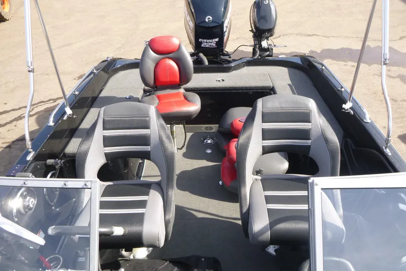 Slide: The Image of 2008 Ranger 620 VS boat interior with seating and Evinrude motor. - 15