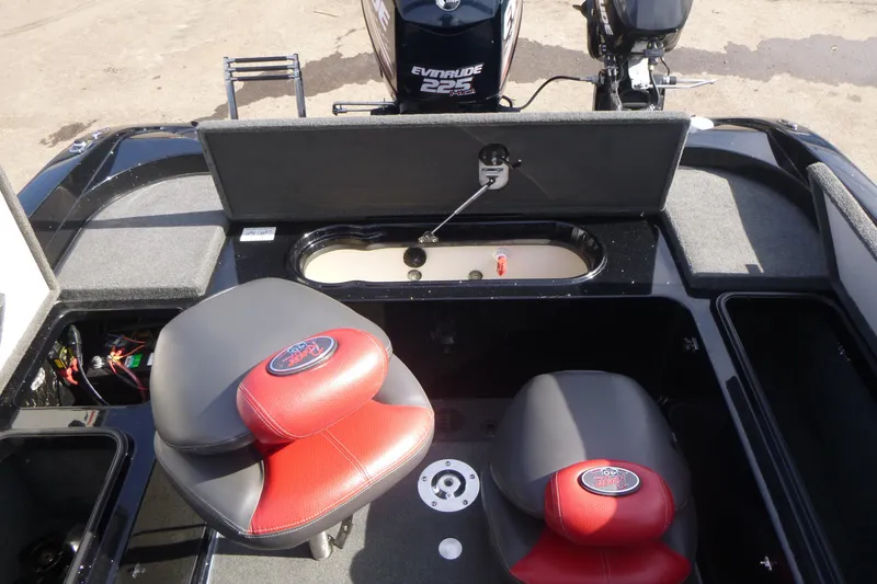 Slide: The Image of 2008 Ranger 620 VS boat interior with red seats and Evinrude 225 motor. - 17