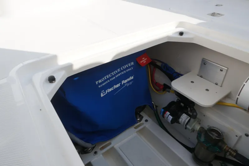 Slide: The Image of 2023 Pursuit OS 355 Offshore boat compartment with Fischer Panda protective cover. - 21