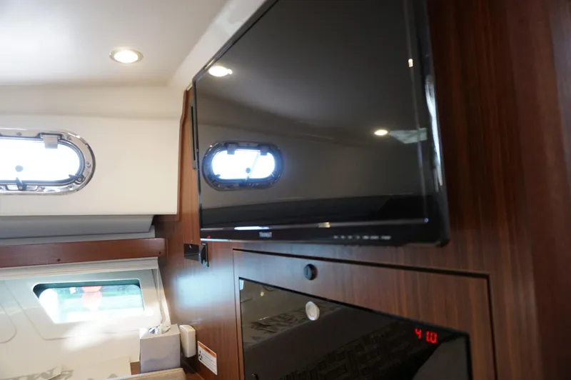 Slide: The Image of Interior of 2023 Pursuit OS 355 Offshore with TV and porthole windows. - 28