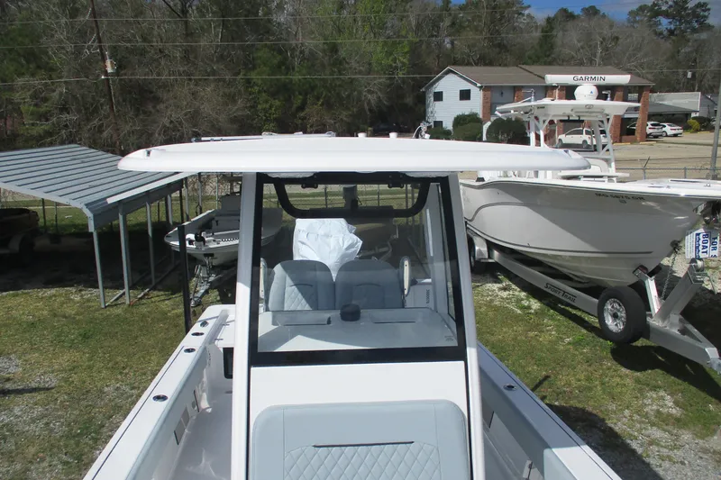 Slide: The Image of 2026 Sportsman Masters 247 Bay Boat, sleek design, parked outdoors, showcasing modern features. - 10