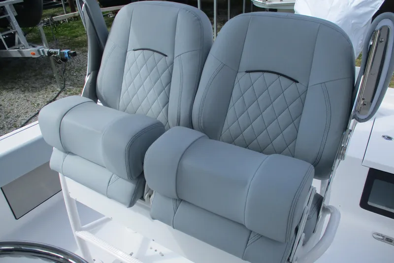 Slide: The Image of 2026 Sportsman Masters 247 Bay Boat seats with gray diamond-stitched upholstery. - 11