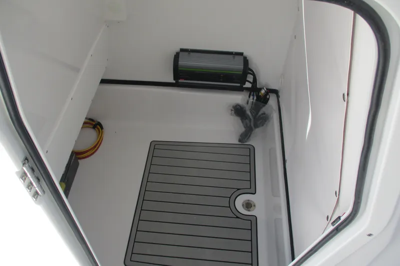 Slide: The Image of Interior storage compartment of 2026 Sportsman Masters 247 Bay Boat, featuring organized wiring. - 14