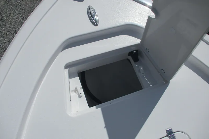 Slide: The Image of Open storage compartment on 2026 Sportsman Masters 247 Bay Boat deck. - 9