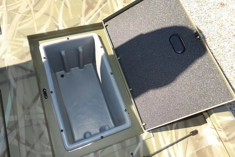 Slide: The Image of Open storage compartment in 2026 Crestliner XFC 189 boat, featuring a spacious interior. - 15