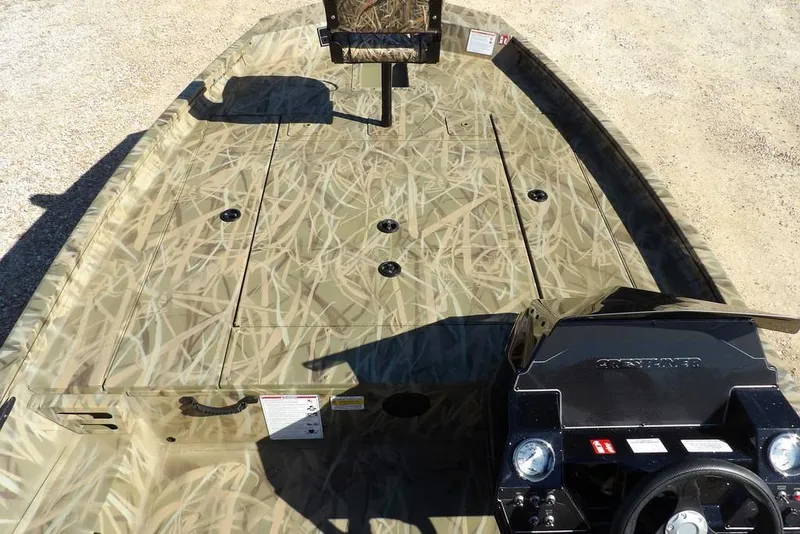 Slide: The Image of 2026 Crestliner XFC 189 boat with camouflage design and spacious deck layout. - 23