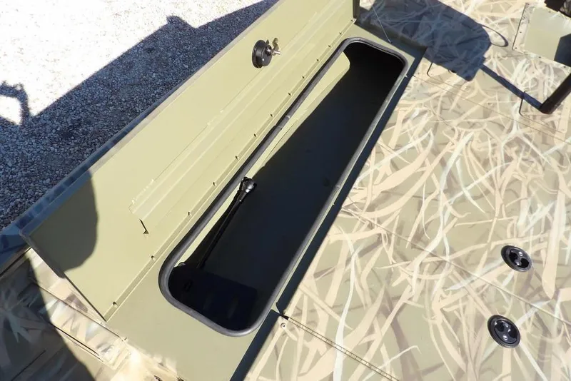 Slide: The Image of 2026 Crestliner XFC 189 boat storage compartment with camouflage pattern. - 30