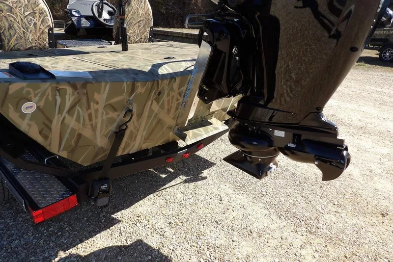 Slide: The Image of 2026 Crestliner XFC 189 boat with camouflage design and powerful outboard motor. - 34