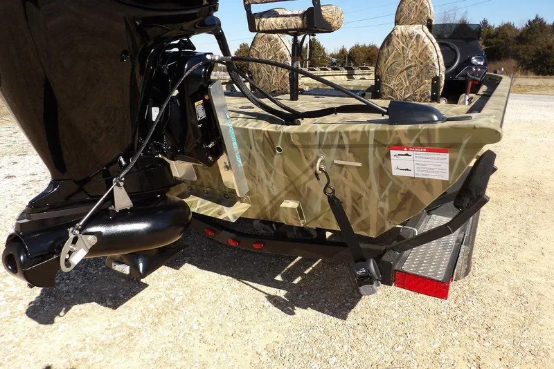 Slide: The Image of 2026 Crestliner XFC 189 boat with camouflage design and powerful outboard motor. - 39