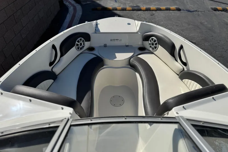 Slide: The Image of 2018 Stingray 208 LS boat interior with sleek seating and modern design. - 13
