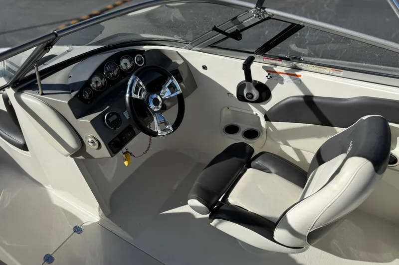 Slide: The Image of 2018 Stingray 208 LS boat interior with steering wheel and dashboard controls. - 24