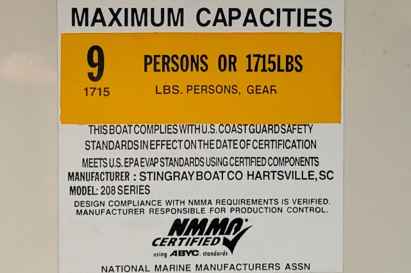 Slide: The Image of 2018 Stingray 208 LS capacity label: 9 persons or 1715 lbs, NMMA certified. - 29