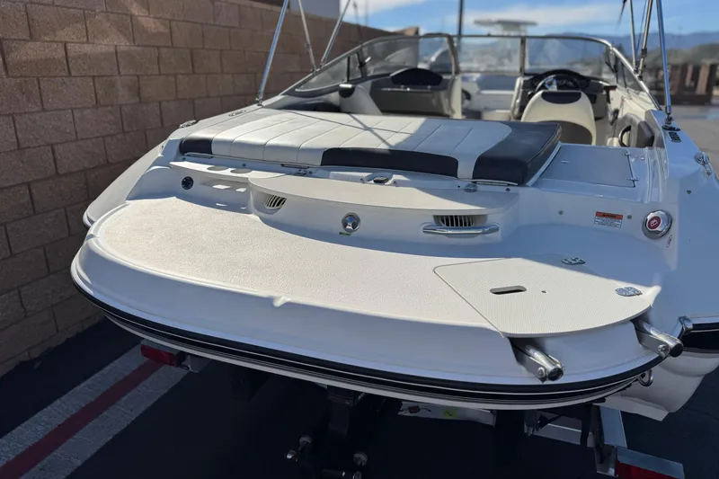 Slide: The Image of 2018 Stingray 208 LS boat with sleek design and spacious seating. - 6